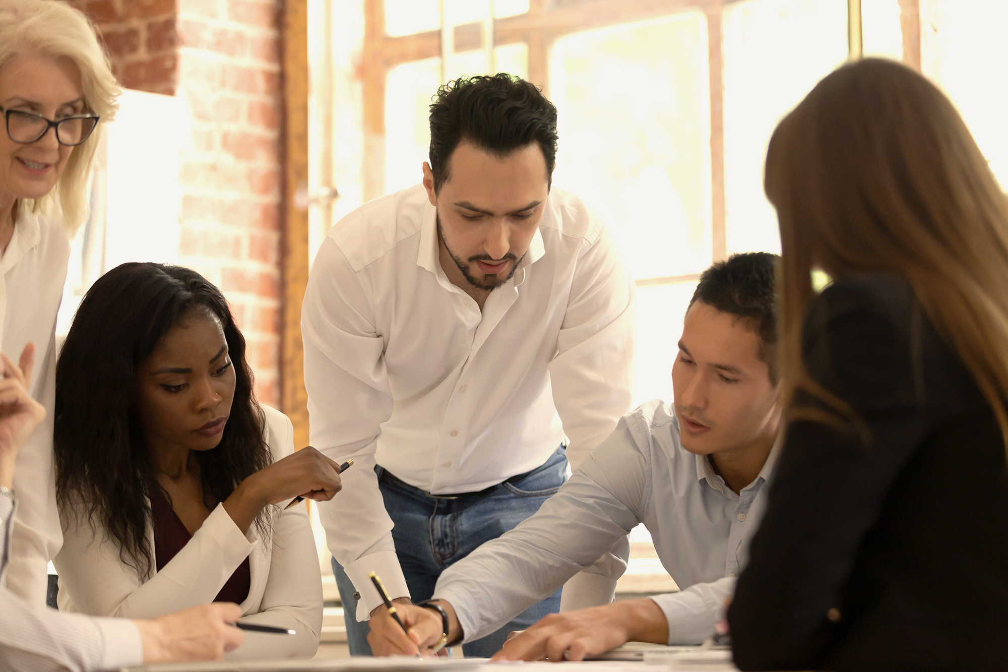 group of colleagues thinking analytically about issue
