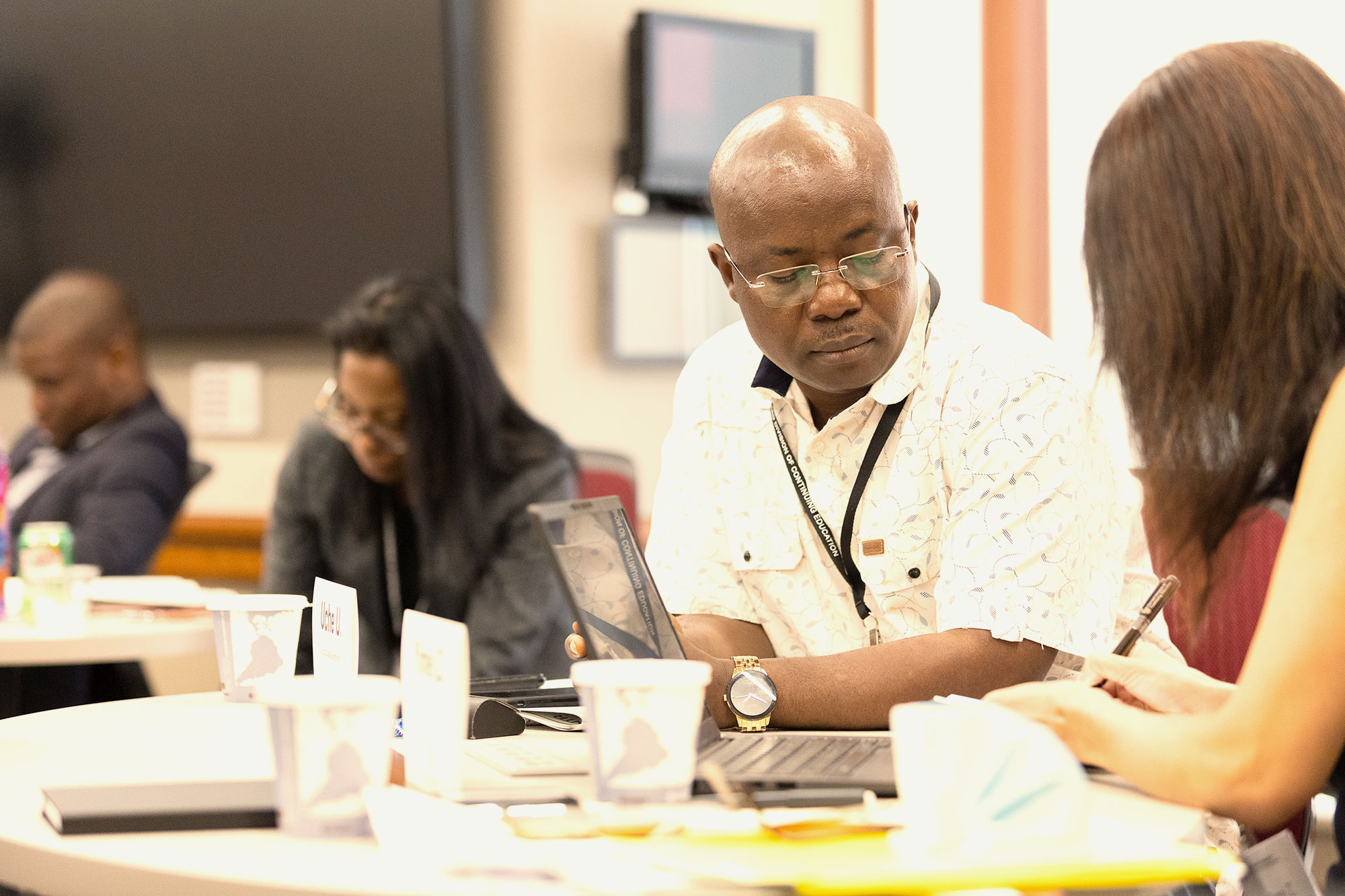 Participants sit in a professional development class.