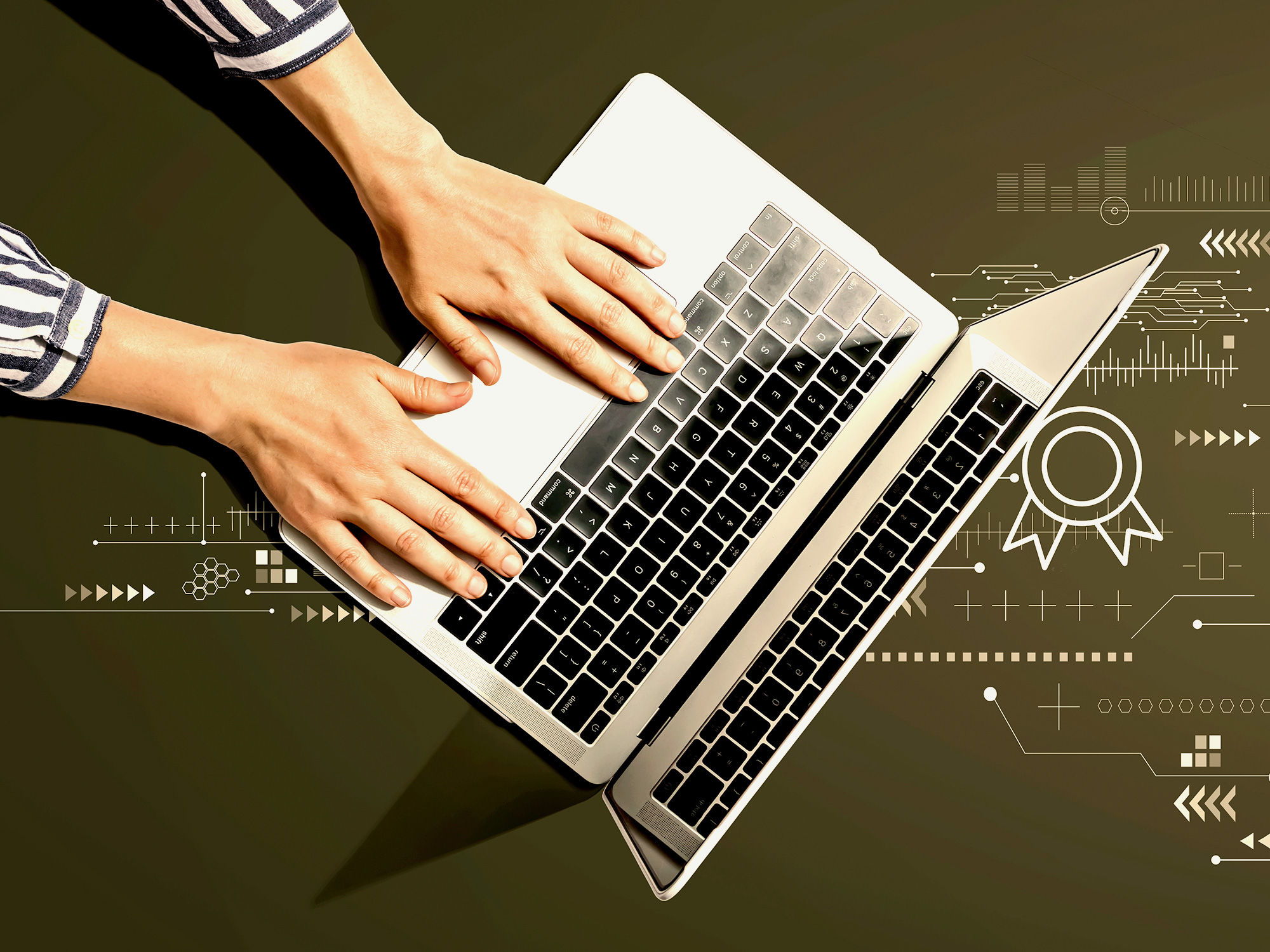 hands on laptop keyboard